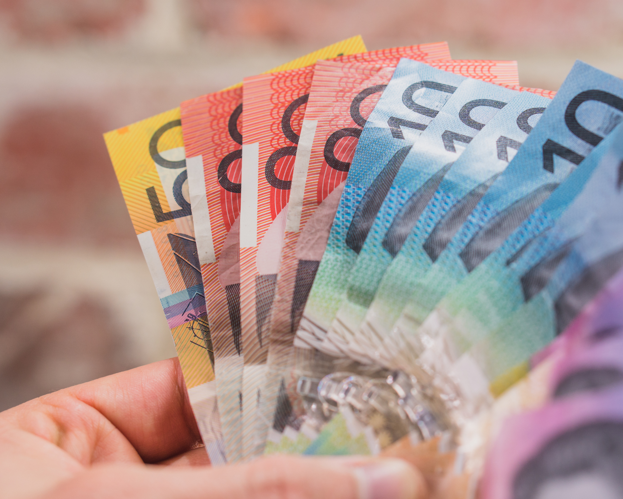 Australian banknotes being held after a container refund.