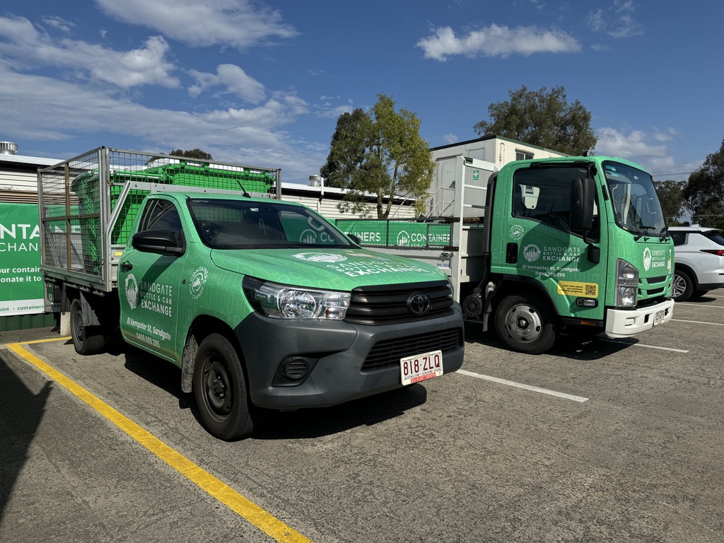 Sandgate Bottle & Can Exchange collection vehicles parked at the depot.