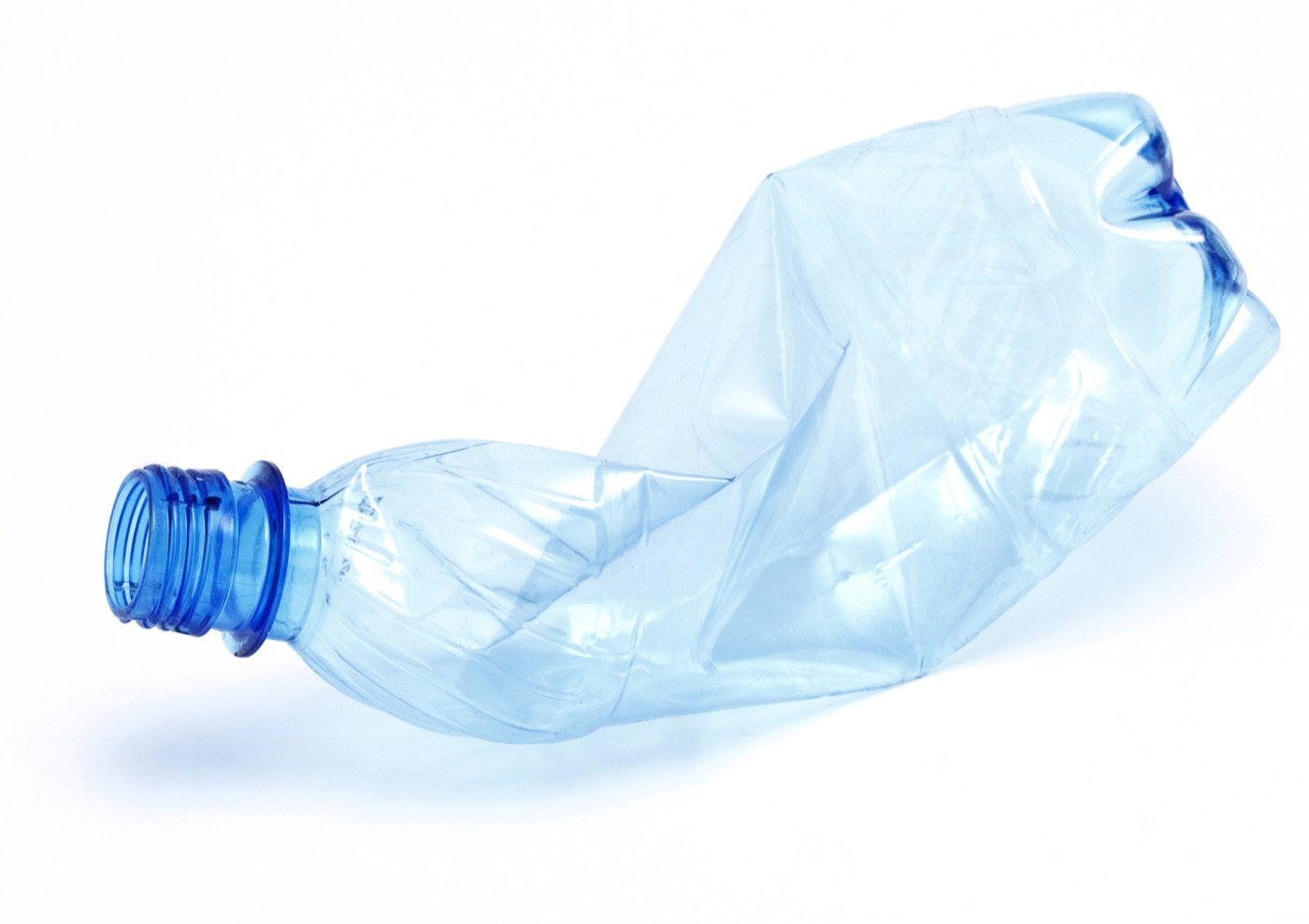 A crushed plastic drink bottle that can still be identified for a container refund